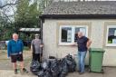 Volunteers Rich, Ali and Dave, who helped clean up the damage left on Machynlleth Football Club.