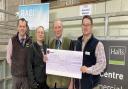 Emyr Wigley (centre) and his niece Laura Pritchard present a cheque for £39,627.94 to Dewi Parry, RABI regional manager for North Wales watched by Halls’ senior auctioneers Jonny Dymond.
