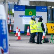 People use a drive through PCR testing site at Liverpool John Lennon Airport. Picture date: Wednesday December 29, 2021.