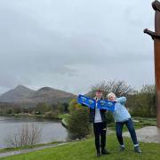 From left to right: 16 years old Josh who accesses the sibling support services at Tŷ Gobaith is pictured with Ceinwen Pritchard at the famous Llafn Y Cewri sword in Llanberis.