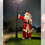 Father Christmas ios getting ready for the illuminated tractor run.