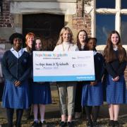 Staff and pupils at Moreton Hall with cheque for Hope House.