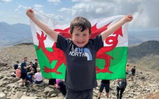 Marley Hughes, four, at the top of Scafell Pike