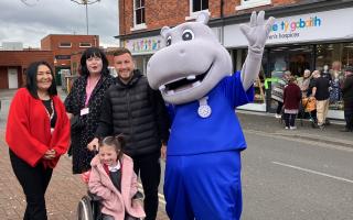 Hope House area manager Lindy Welch-Smart, head of retail Suzanne Cumming, Wrexham FC’s Luke Young, Hope House Hippo and Amelia Thompson.