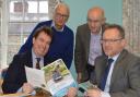 Montgomeryshire’s MP Craig Williams and Assembly Member Russell George discuss the 10-year Montgomery Canal restoration plan with Montgomery Waterway Restoration Trust chair Michael Limbrey (standing left) and Montgomery Canal Partnership chair