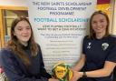 The New Saints FC players Millie Evans (left) and Kiera Tomlinson with details of the scholarship programme.