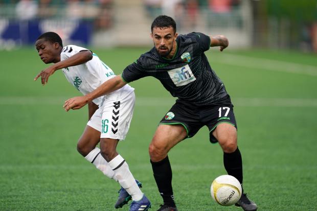 The New Saints' Jordan Williams and Kauno Zalgiris' Abdulgafar Opeyemi battle for the ball during the UEFA Europa Conference League match at Park Hall, Oswestry. Picture date: Thursday July 29, 2021..