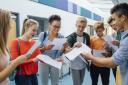 Stock image of students collecting results in previous years