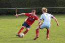 Wem player Dan Hill on the ball against Malvern Town. Picture by Ian Stading