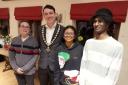 Town mayor Jay Moore welcomes French teenagers Flavien, Kali and Brice to Oswestry.