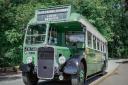 An antique bus at the The 150th anniversary of the Glyn Valley horse drawn tramway .