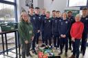 Helen Missen of Oswestry and Borders Foodbank and Gill Jones of The New Saints FC Foundation with Jimmy O'Reilly of the foundation and TNS FC players.