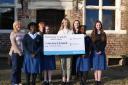 Staff and pupils at Moreton Hall with cheque for Hope House.