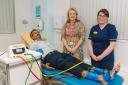 Mr Nilesh Makwana, Consultant Orthopaedic Foot and Ankle Surgeon; Victoria Sugden, League of Friends Charity Director; and Ruth Carle, Pre-Operative Assessment Unit Nurse Practitioner; with the Dopplex ABI machine.