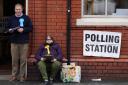 Party members outside the polling station at the Memorial Hall in Oswestry, during voting for the North Shropshire by-election