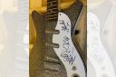 The signed Manic Street Preachers guitar which will be up for grabs at the auction