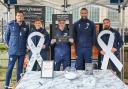 The New Saints FC players at the White Ribbon Day market stall.