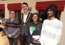Town mayor Jay Moore welcomes French teenagers Flavien, Kali and Brice to Oswestry.