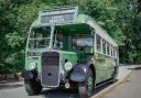 An antique bus at the The 150th anniversary of the Glyn Valley horse drawn tramway .