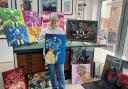 Artist Amy Brown with her work at Oswestry Framing.