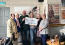 Dave Lloyd and Ally Beckett with the cheque and Lukey's sisters (l-r) Mandie Beverley Jo and Linda .
