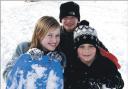 Enjoying sledging at Gatacre, Oswestry, pictured, from left are Alisha Griffiths, Henry and Isaac Isles.