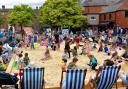 People enjoying the 2024 Festival Square beach courtesy of Oswestry BID.