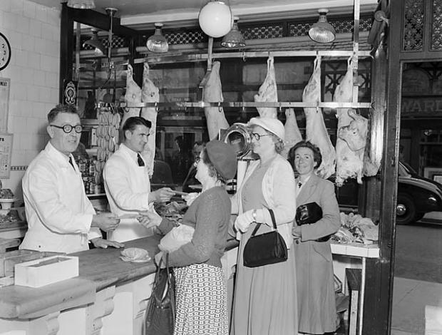 Border Counties Advertizer: Harry Morris, Oswestry butcher, celebrates the end of meat rationing with some of his customers in 1954. Picture by Geoff Charles/Wikimedia.