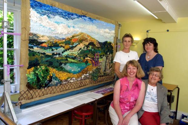 Border Counties Advertizer: Members of the community from Llansilin, near Oswestry, have made a rag rug of the Gyrn which will be presented to the Village hall on completion. The rug started off as a community course in 2001, old clothing was collected from the village and the
