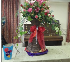 A Cadburys Rose themed floral display