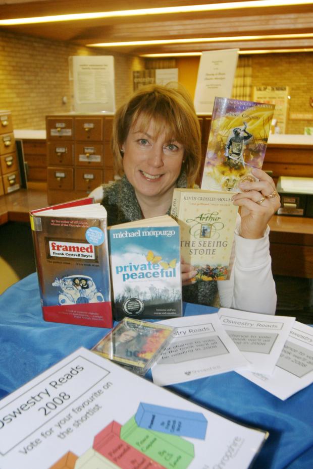 Border Counties Advertizer: Oswestry Library are encouraging townspeople to take part in the Big Read 2008 to celebrate the opening of the new library. Pictured with the five books that people are to read and give feedback on is Julie Johnson, library Administrator.HD191207