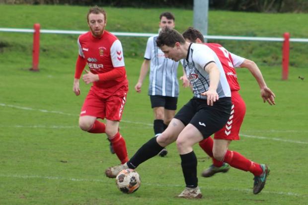 Border Counties Advertizer: Action from Brecon Corries' victory over Llanfyllin Town. Picture by Barcud-Coch Photography.