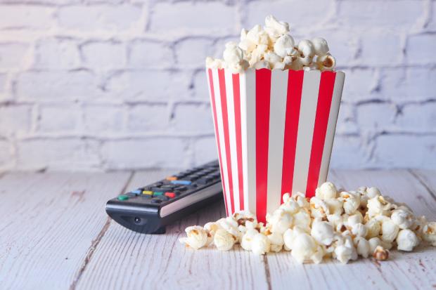 Border Counties Advertizer: A box of popcorn and a TV remote (Canva)