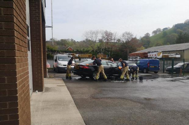 Firefighters washing cars at Llanfyllin Fire Station