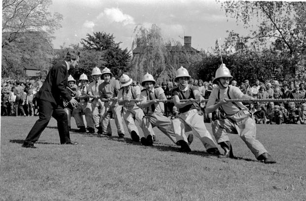 Border Counties Advertizer: Oswestry firemen in a tug - o - war competiton at Cae Glas Park, Oswestry, during the Jubilee celebrations.