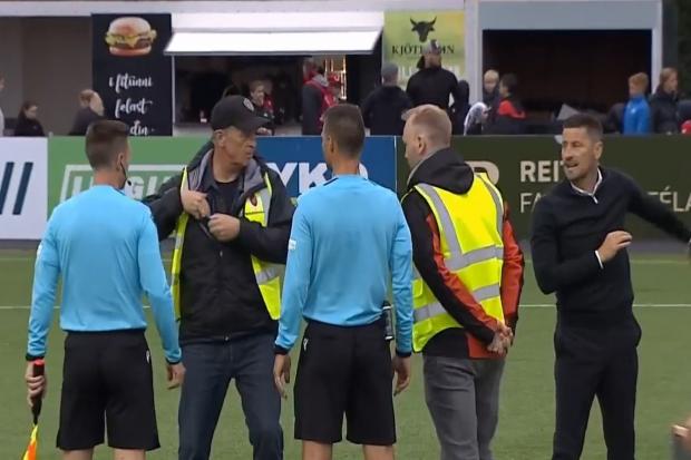 Anthony Limbrick (far right) speaks to the referee after pulling his players away. Image via S4C.