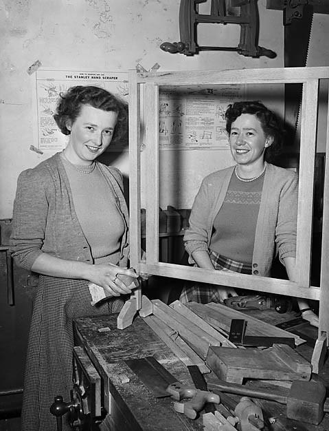 Border Counties Advertizer:  two shorthand typists working on a fireguard during a woodwork night class in Llanfyllin in 1951. Picture: Geoff Charles Collection.