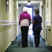 Generic image of old person with a nurse in a care home. Pic: PA