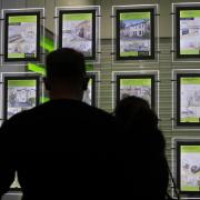 People looking at the signs in an estate agent's window. PRESS ASSOCIATION Photo. Pic: Yui Mok/PA Wire.