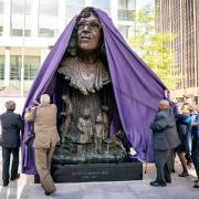 The family of Betty Campbell unveil the bronze sculpture of her during the unveiling of the statue in Central Square, Cardiff, of Betty Campbell, Wales' first black headteacher.
