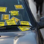 File photo dated 20/12/17 of parking Notice fixed penalties are attached to the windscreen of a Land Rover Freelander on South Carriage Drive in Hyde Park, London. Car parks could be overrun by a 