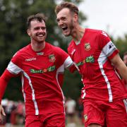 Ed Baker and Jack Orbell celebrate Chirk's winner against Porthmadog on Monday. Picture: FAW.