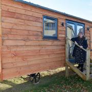 Salop Leisure Innovative Solutions’ project manager Samantha Stubbs with one of the shepherd’s huts.