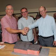 Pastor Chris Shaw with predecessors Elfed Godding and Derek Hughes cutting the cake.