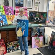 Artist Amy Brown with her work at Oswestry Framing.
