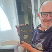David Woodward with his book 'Confessions of a Waiter'.