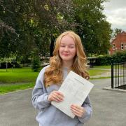 Lucy Garton collects her results at Marches in Oswestry