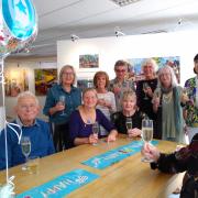 Members of the Stammtisch raise a glass at the Willow Gallery in Oswestry to celebrate ten years.