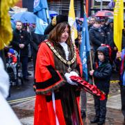 Oswestry mayor Councillor Olly Rose prepares to lay a wreath.