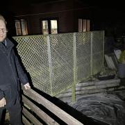 Councillor James Owen at one of the flooded properties.